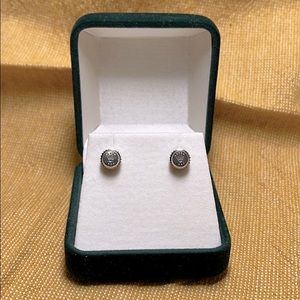 Rolex stainless steel watch crown stud earrings.